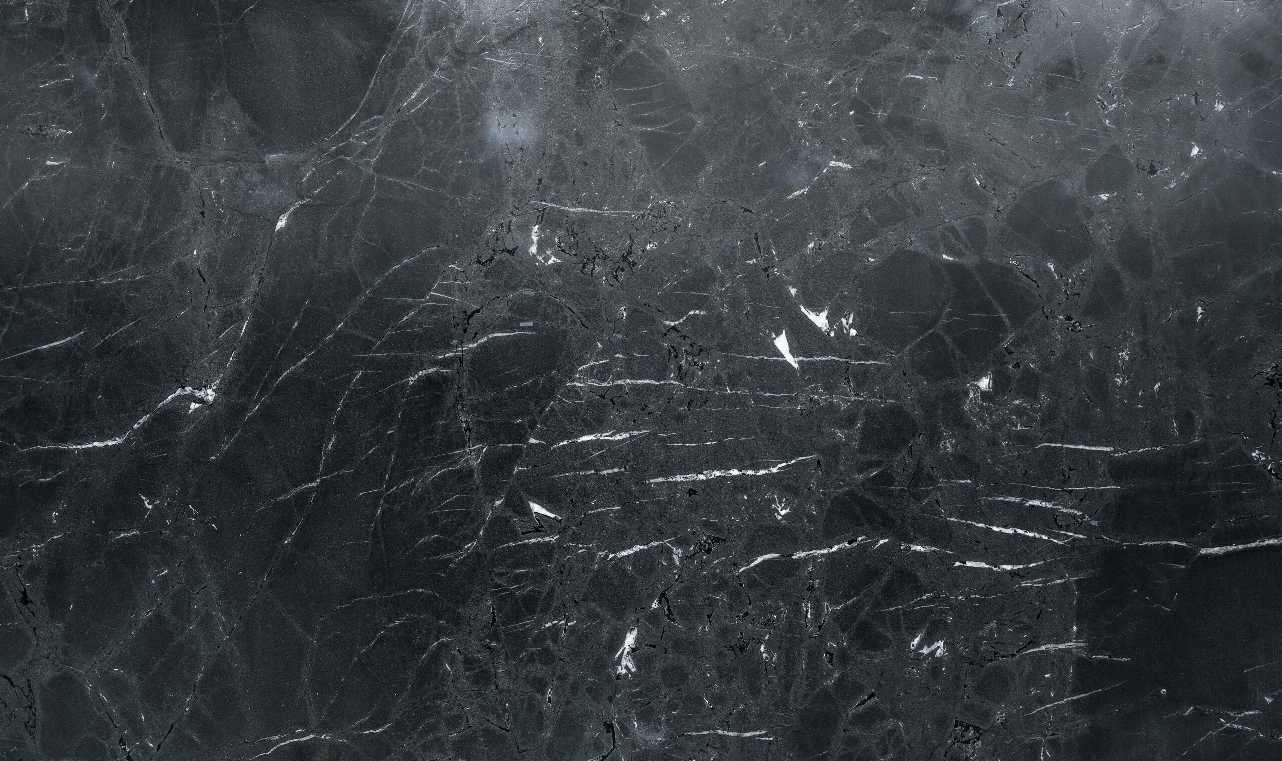 High-resolution dark marble texture, perfect for elegant backgrounds and design projects.